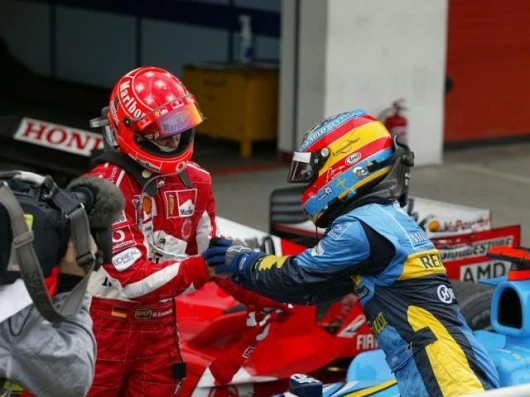 The leading contenders embrace after the race - Michael Schumacher and Fernando Alonso
