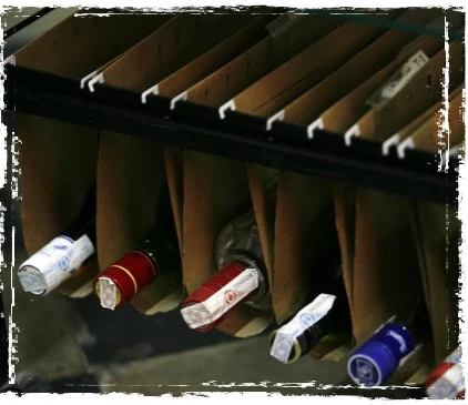 Bottles sit neatly in upcycled filing folders