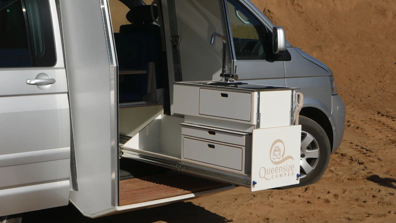 The kitchen stacks together and can slide inside for use under the module roof