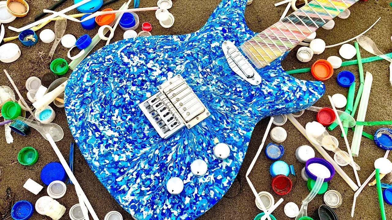 The body of the guitar is made from recovered plastic waste from oceans, rivers and coastlines, while the neck features plastic straws and bottle tops