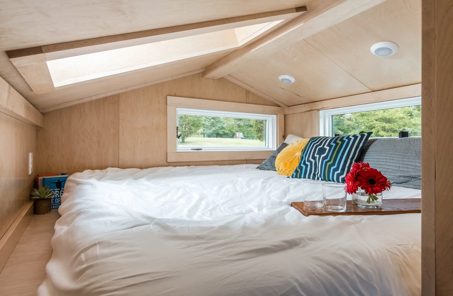The Orchid Tiny House's bedroom includes a king-size bed