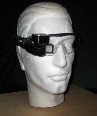While wearing the glasses, a pilot can see a 3D virtual overlay of the runway and airport in one eye