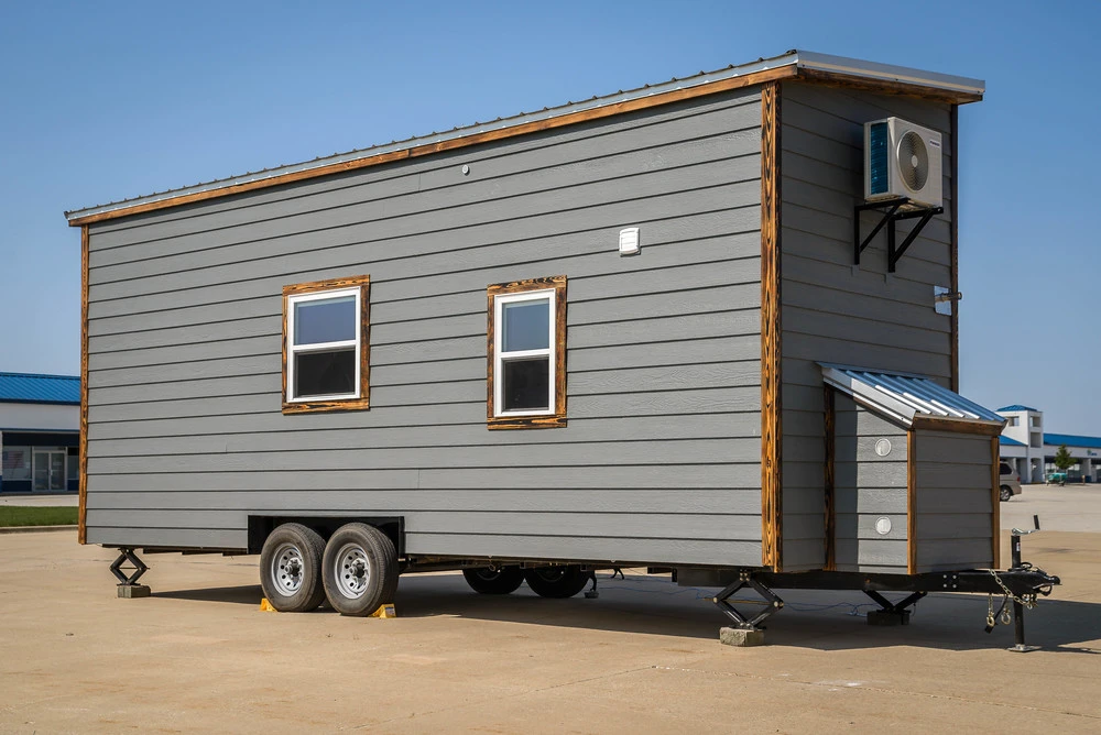 Measuring 8 x 24 ft (2.4 x 7.62 m), Triton sits on a double-axel trailer and features a similar color scheme to the the firm's Chimera tiny house