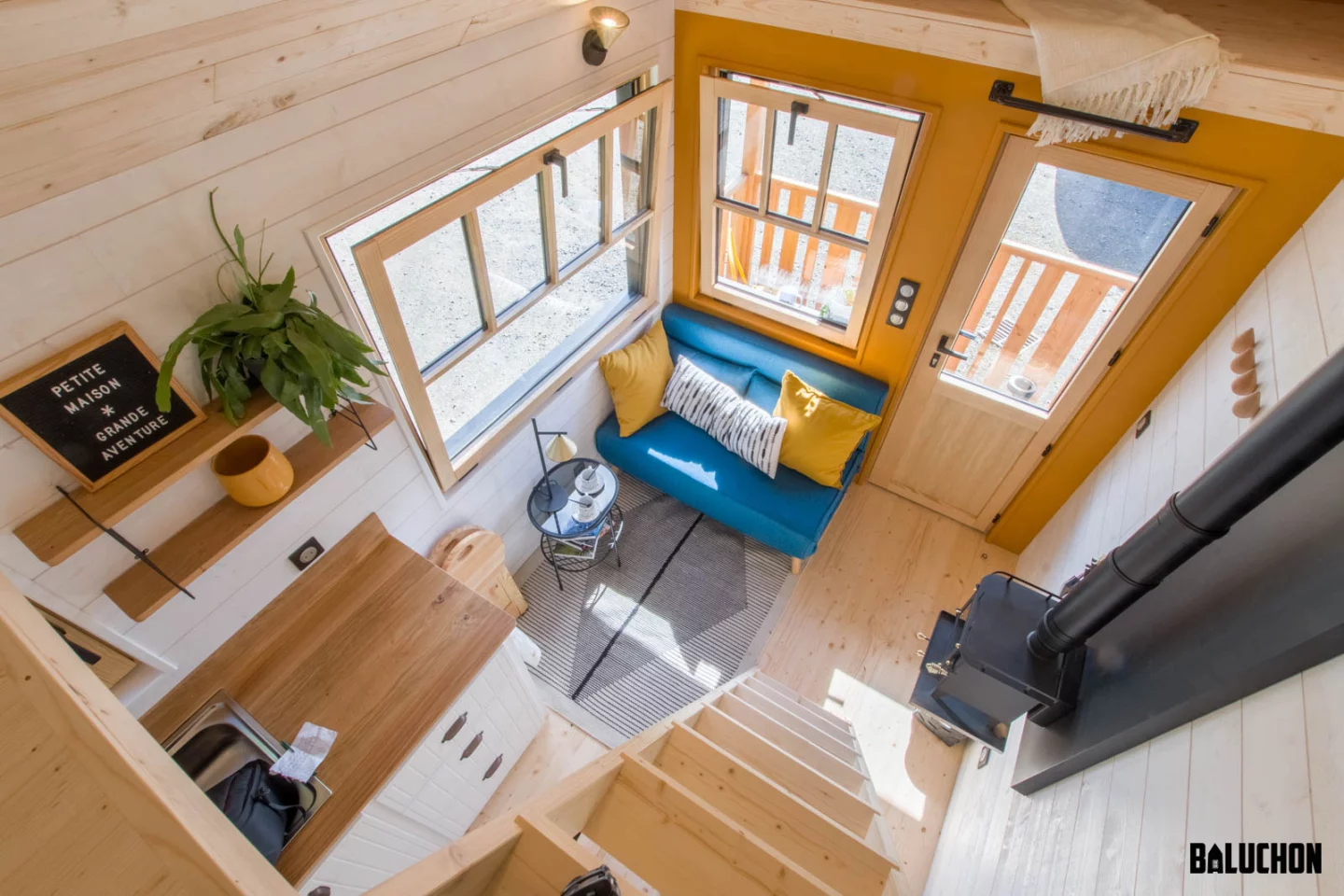 The Miss Twain Tiny House's living room is snug but light-filled thanks to the generous glazing
