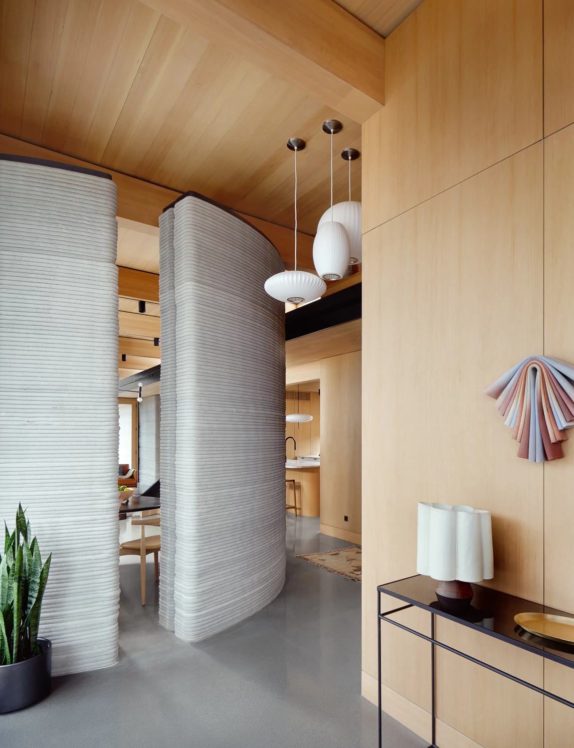 House Zero's interior includes three bedrooms and 2.5 bathrooms, as well as a kitchen and central living room