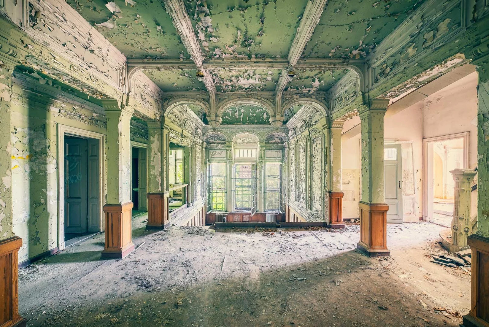 The paint is peeling off the walls and the skeleton of the architecture is gradually being uncovered as this former villa falls apart
