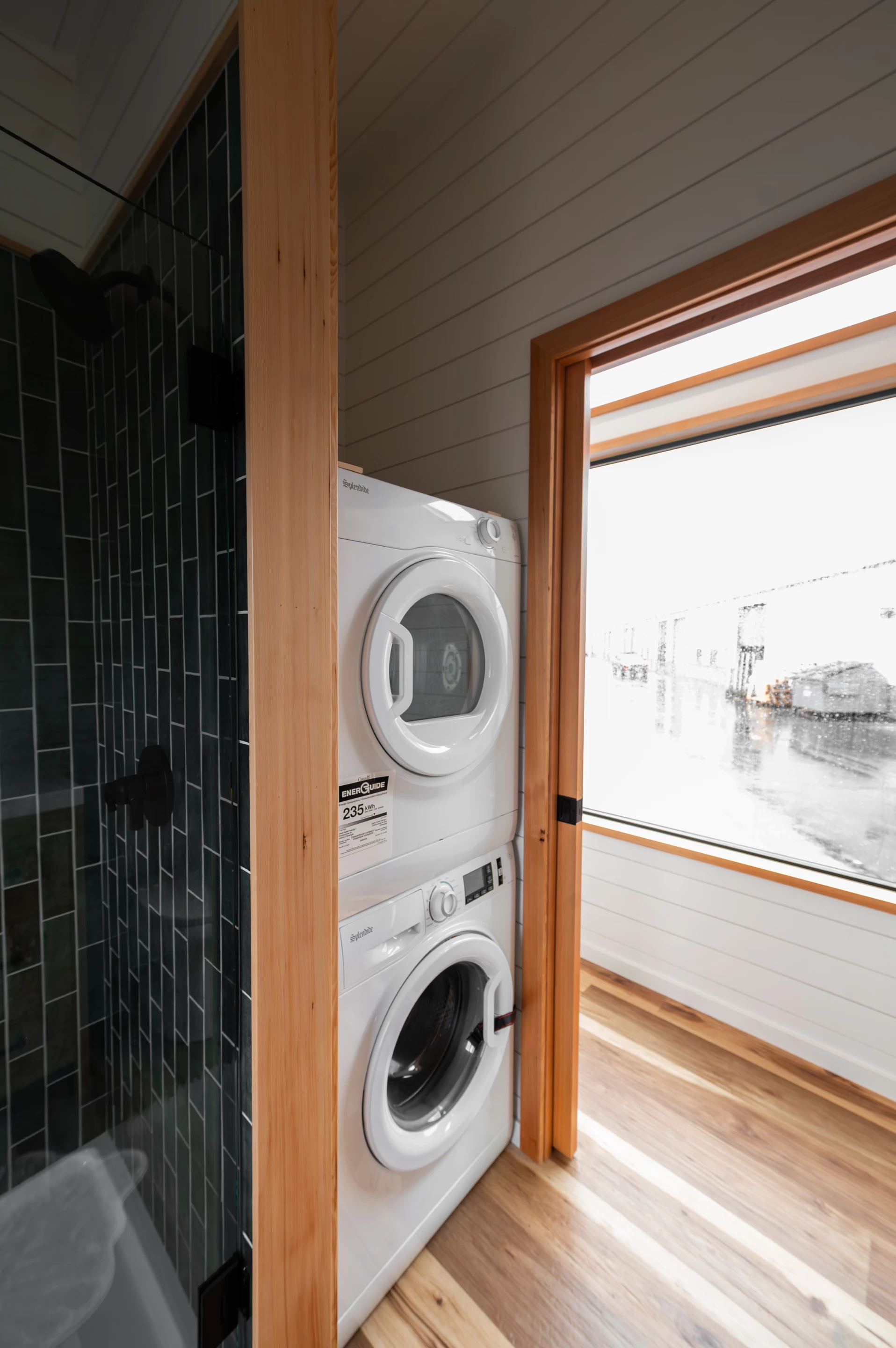 The Urban Park Max 37 has a small laundry area next to the bathroom that contains a stacked washer/dryer