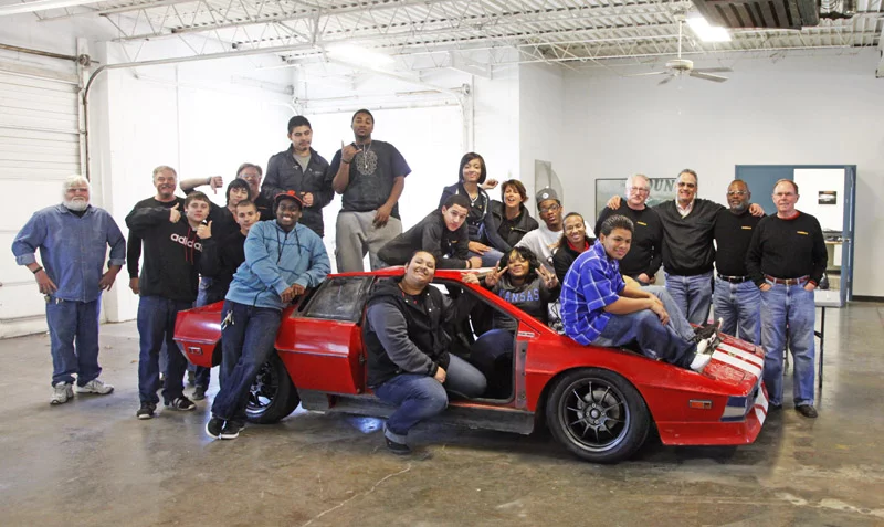 Students at MINDDRIVE testing the refreshed suspension of the donated Lotus Esprit