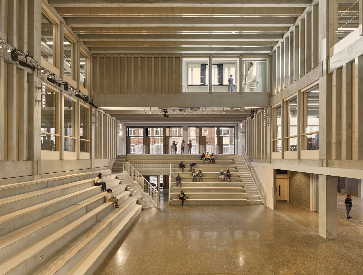 Kingston University London - Town House is arranged around a central foyer that includes multiple areas for students to meet