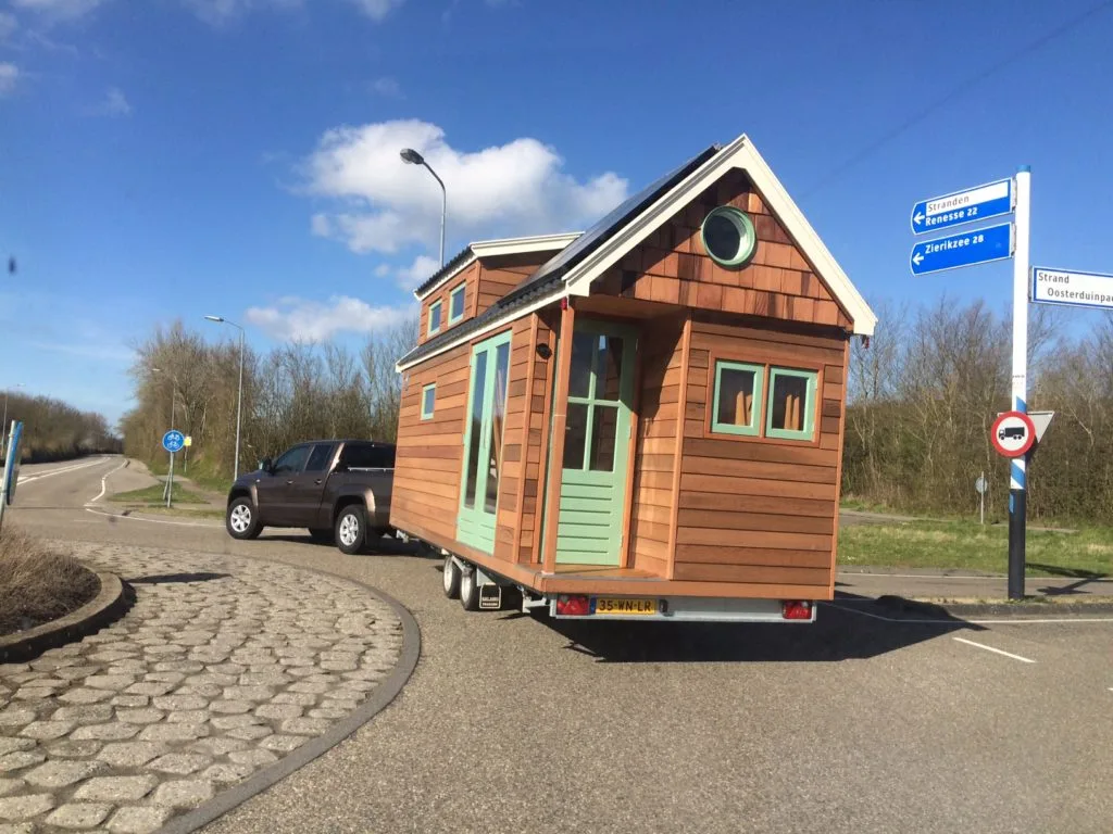 The tiny home sits on a trailer for easy towing