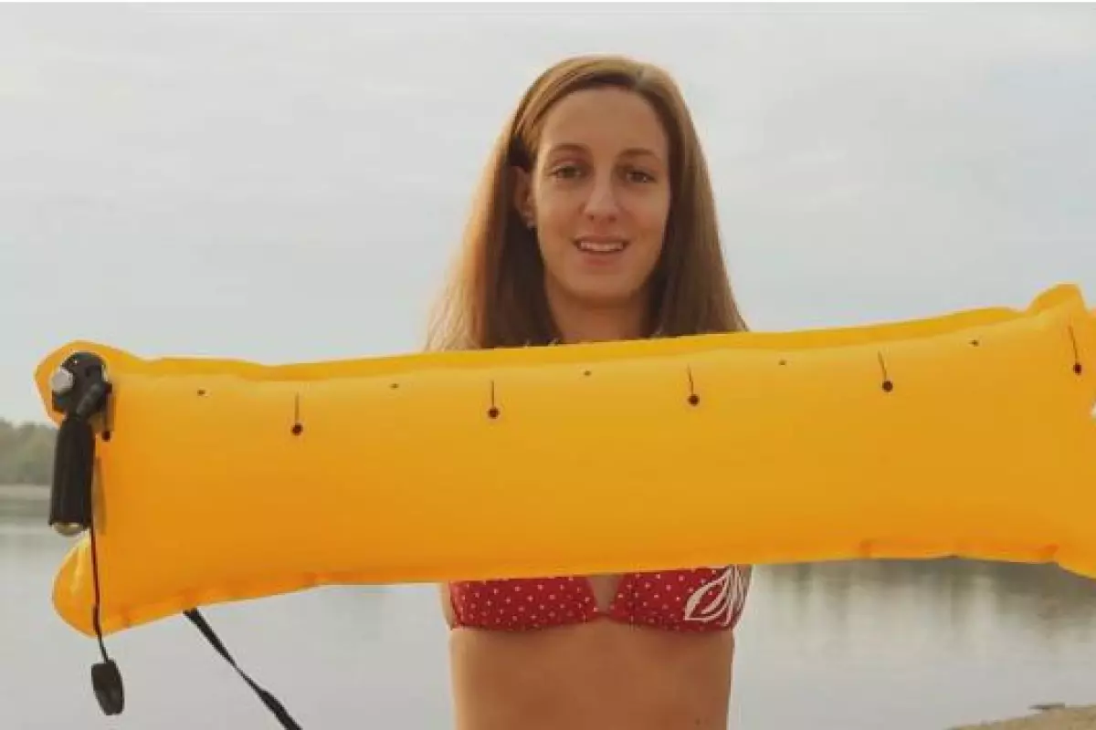 When the Restube inflates, the user holds onto it to keep afloat