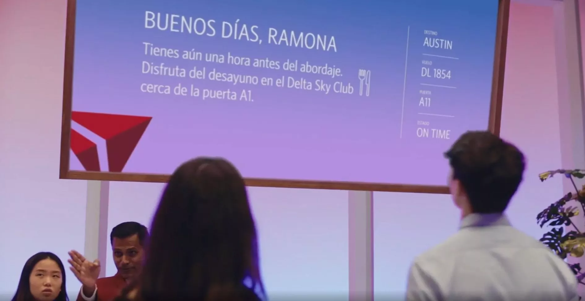 Thanks to Parallel Reality display technology, only the person on the left will see a personalized message onscreen. The person on the right will see something tailored to them.