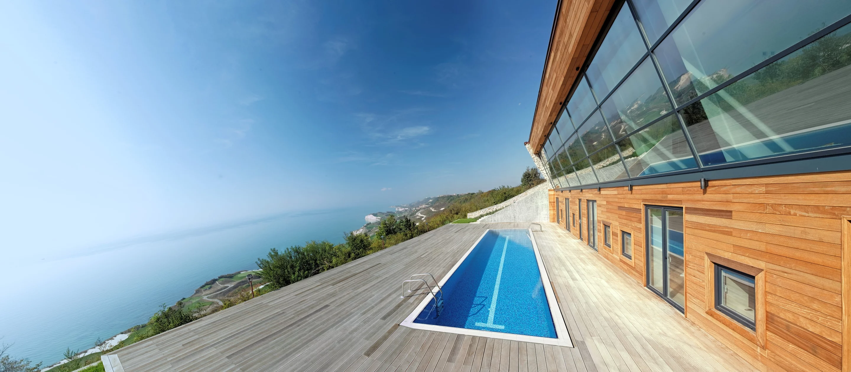 Equinox House's south-facing pool doubles as a reflector, bouncing light into the house (Photo: Ignatov Architects)