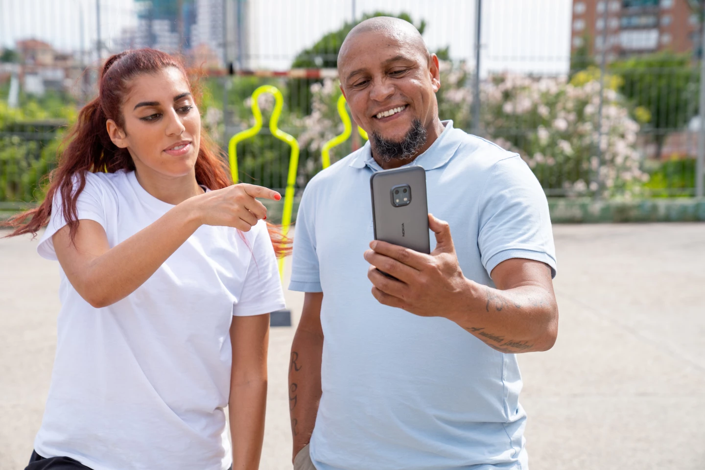 HMD Global asked sports personalities Roberto Carlos and Lisa Zimouche to put the XR20 through a series of durability challenges, including a dunk in icy water, a screen-first spin across a gravel soccer pitch, and a recreation of Carlos' "banana shot" from the 1997 Brazil vs. France international game