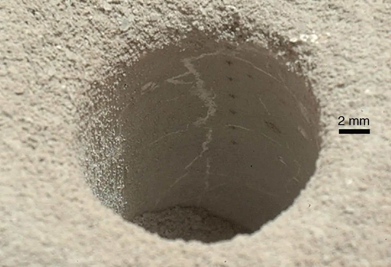 The hole that NASA's Curiosity Mars rover drilled into a target rock provided a view into the interior, as well as obtaining a sample of powdered material from the rock (Image: NASA/JPL-Caltech/MSSS)