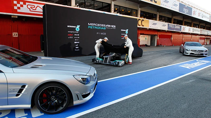 Mercedes AMG Petronas F1 car, two Mercedes-Benz SL63 AMG's and a couple of German blokes