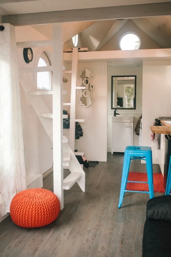 The interior of of the home features an open integrated living/dining and kitchen area