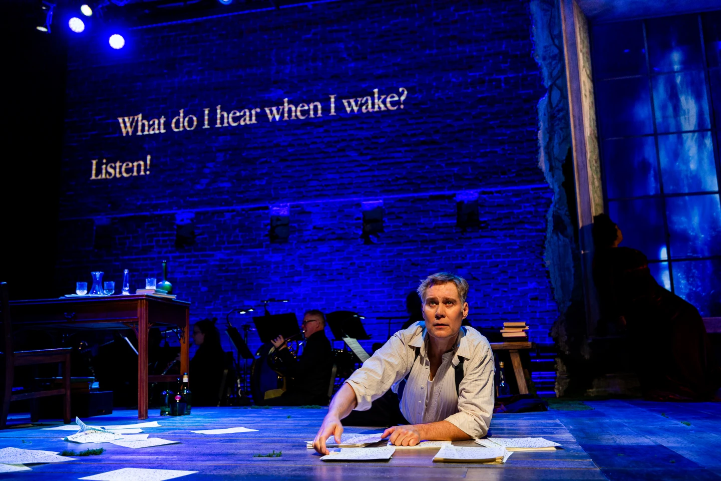 A human operator cues the projected words to follow the live performance