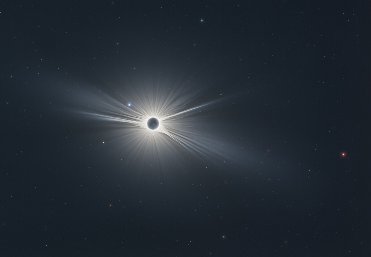Winner in the Our Sun category. In order to capture this mesmerizing image, the photographer chose the area according to weather forecasts to make sure he would get a clear sky. The image shows the Sun's corona in all its glory during the August total solar eclipse. It is flanked on the left hand side by the blue star Regulus – the little King – and by Mars on the right