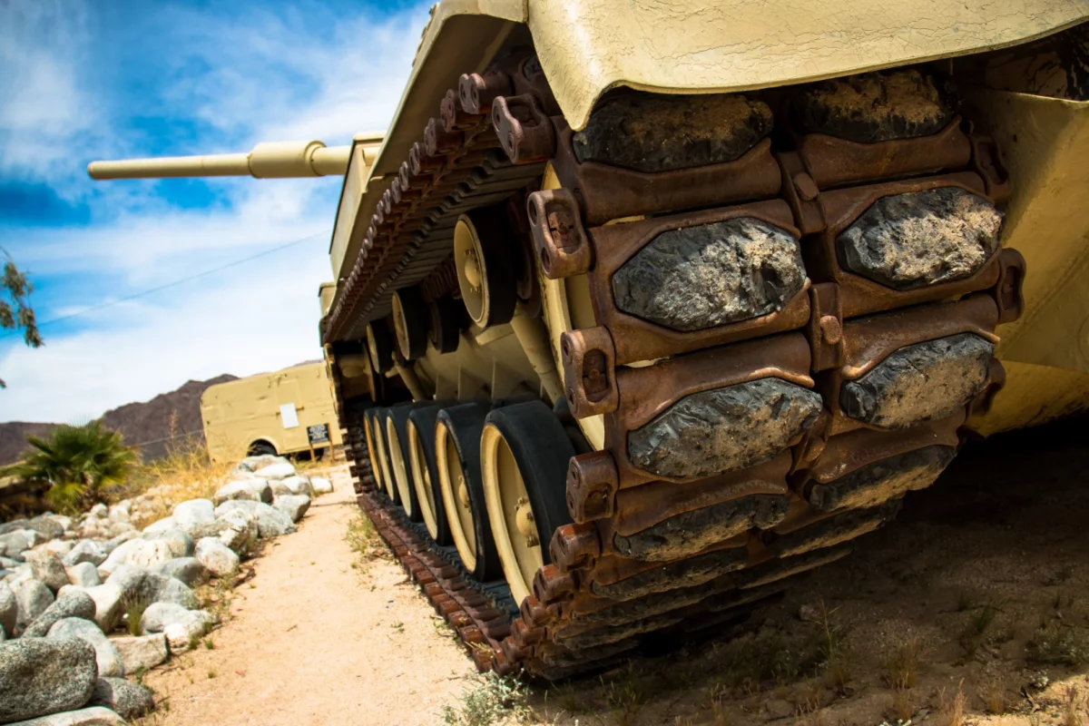 On these tracks with rubber shoes with only 18 inches of ground clearance, the M60 Patton Tank was capable of a vertical 49 inch obstacle climb and fording waters as deep as 48 inches.