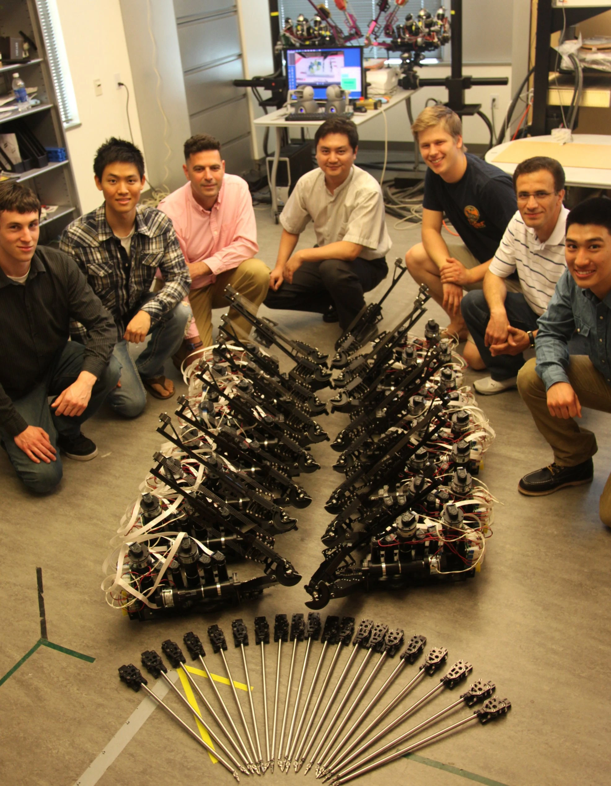 Team members posed with components of the Raven II surgical robotic systems (Photo: UC Santa Cruz)