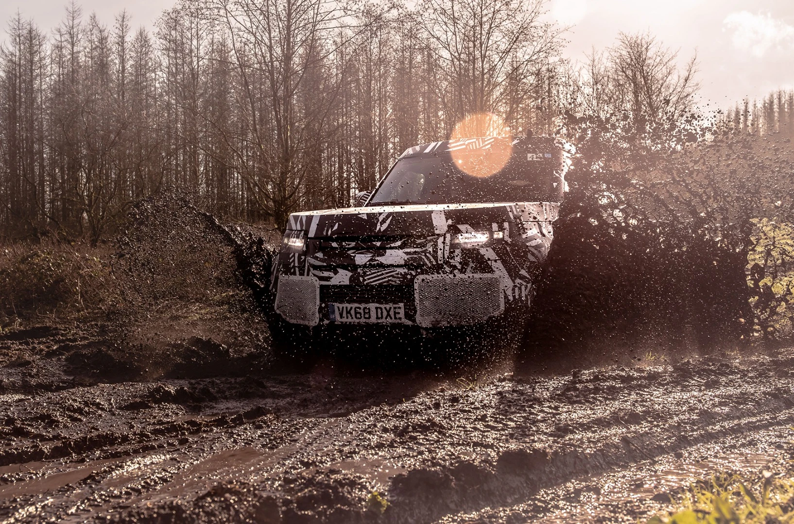The prototype Land Rover Defender battling the mud of Eastnor, UK