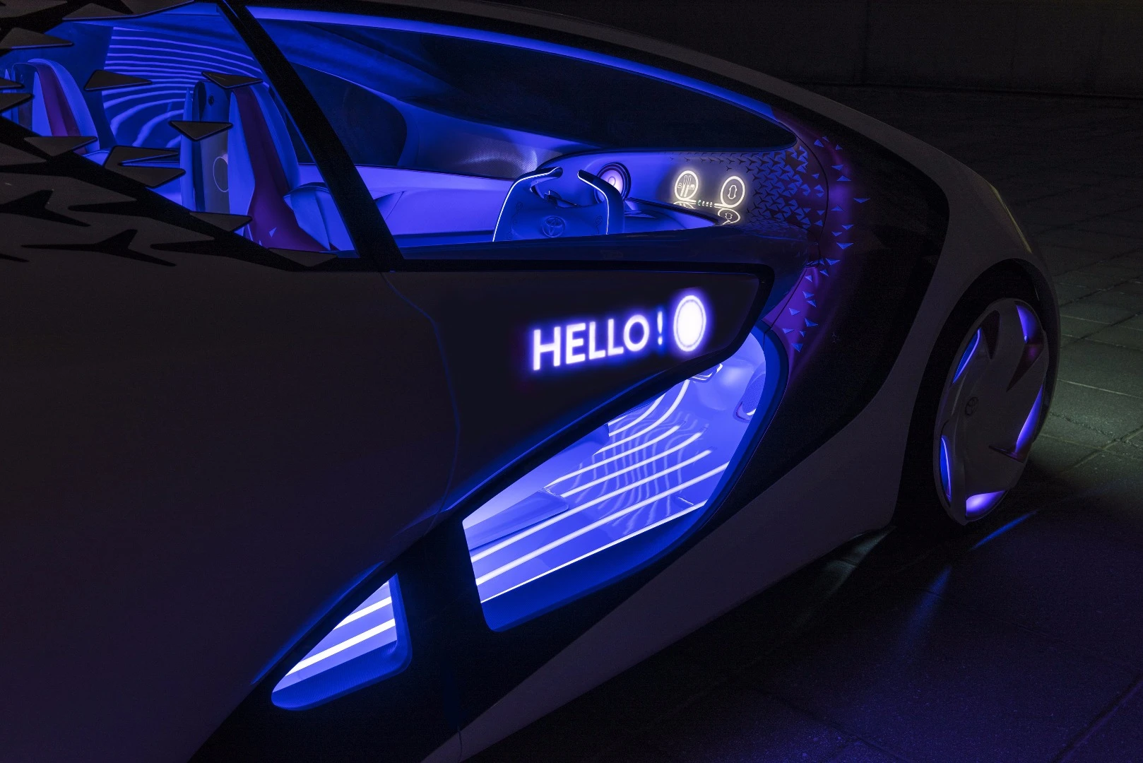 The interface provides both interior and exterior alerts and notifications, including driver greetings