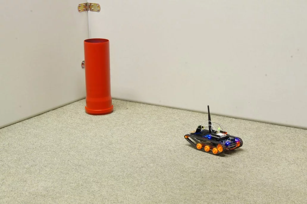 The robot makes a bee-line for a red cylinder, after learning that "red is good"