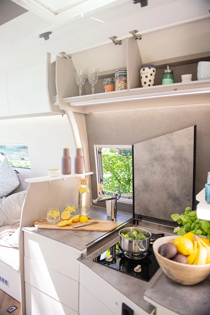 An optional package upgrades the 7.0 Lounge kitchen with the inset stove and swing-away worktop, pull-out countertop extension and more