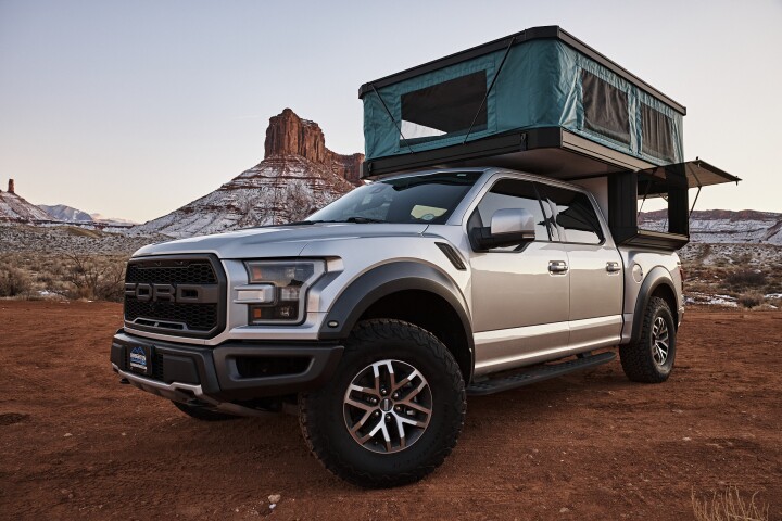 A Ford F-150 Raptor with Tune M1 topper sure looks like a fun weekend