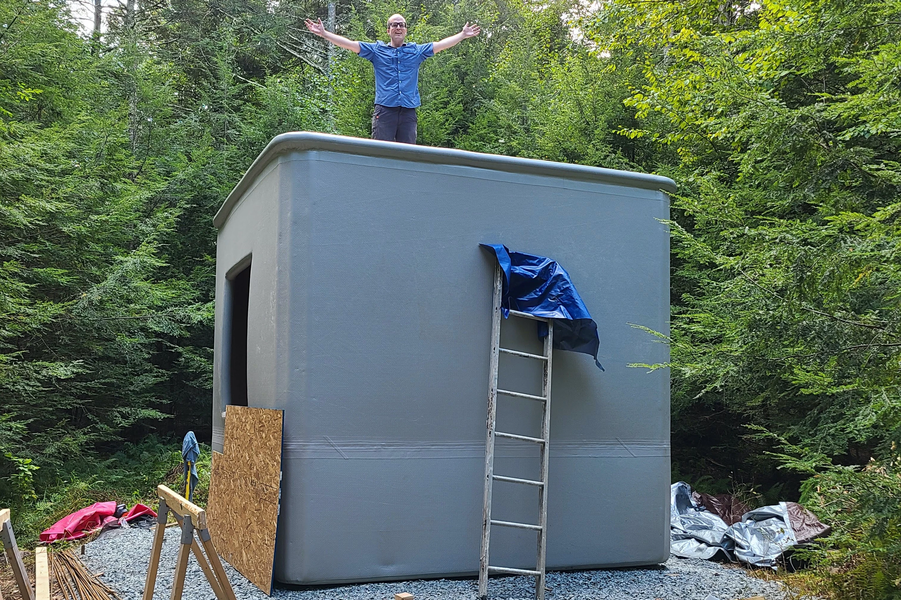 Automatic Construction CEO Alex Bell stands atop a prototype building which was constructed using his company's Flexible Factory Formwork system