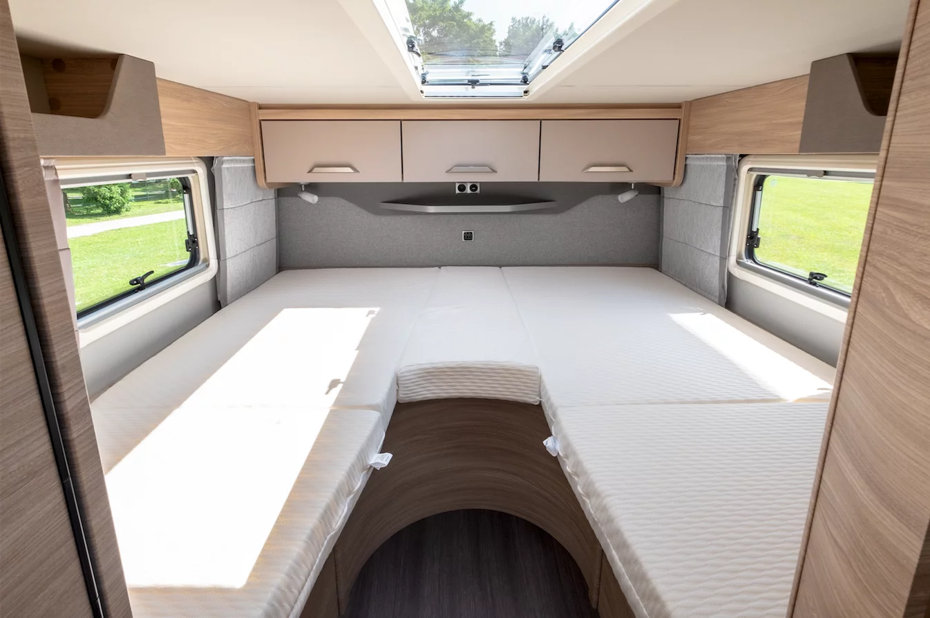 The 650 MEG floor plan includes dual single beds in the rear