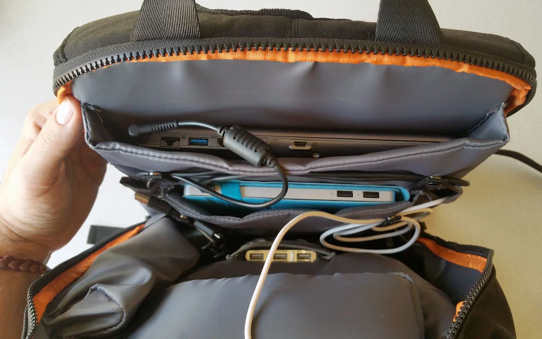 The MOS Pack's main compartment has room enough for a laptop, tablet, small device (e.g. power bank), and cables