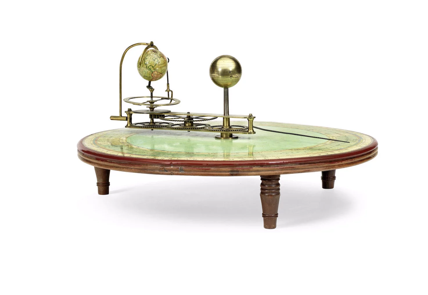 This combined tellurium and planetarium from early 19th century England features models of the Sun, Moon and Earth and sits on paper printed with calendar, zodiac and compass points