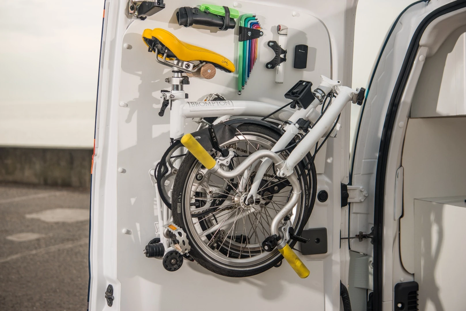 A built-in door rack holds the Brompton bike in place, providing a lighter, more maneuverable means of transportation
