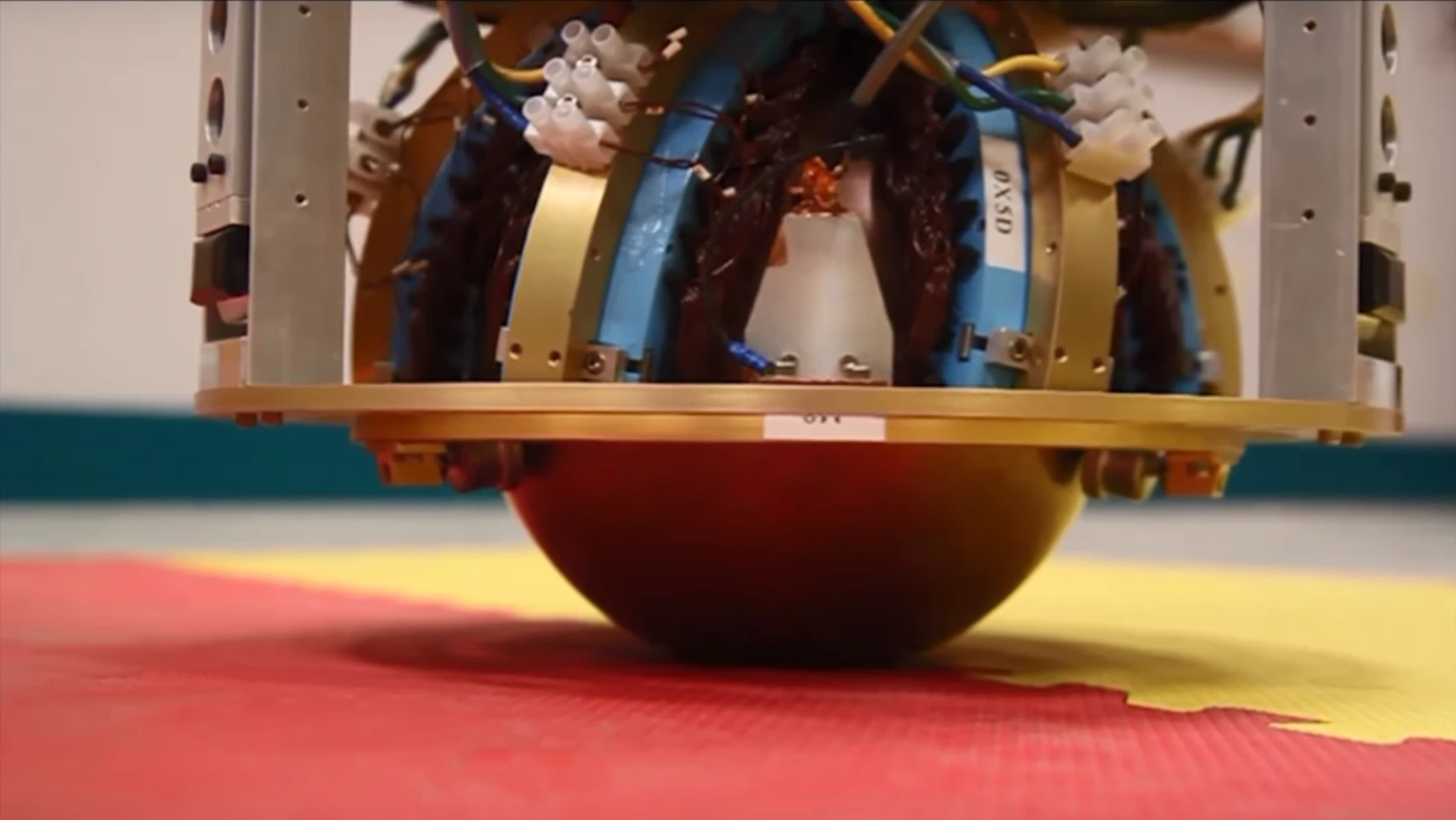 The SIM rests on a hollow iron ball inside a copper shell