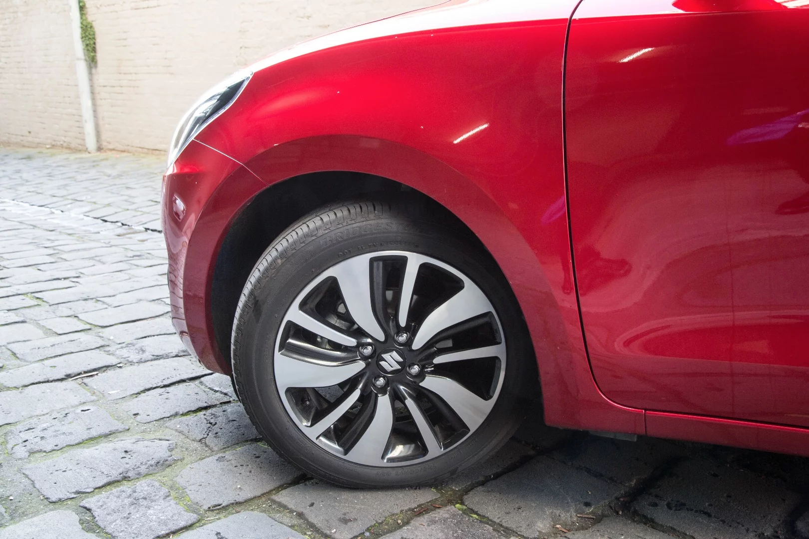The polished alloy wheels on the Suzuki Swift GLX Turbo