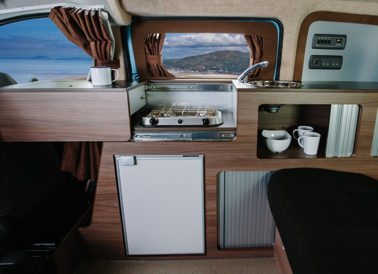 Hillside Leisure does a good job making the most of the Nissan e-NV200's limited space, relying on a compact but fully equipped kitchen with sliding countertop