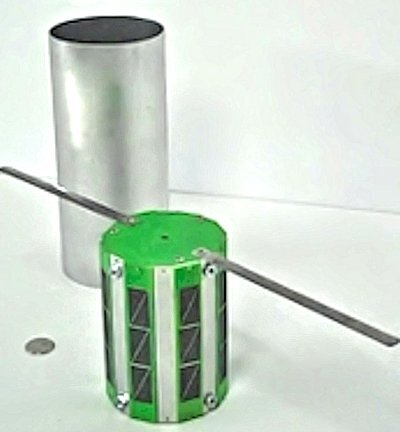 An Interorbital Systems Tubesat showing its antennas and solar cells next to its ejection chamber