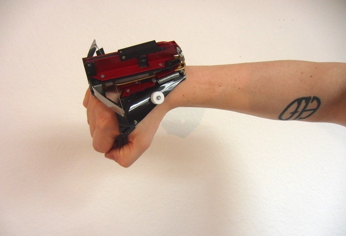 The WristBow Mk II stores multiple carbon fiber darts in its ammo clip, which drop into place as needed