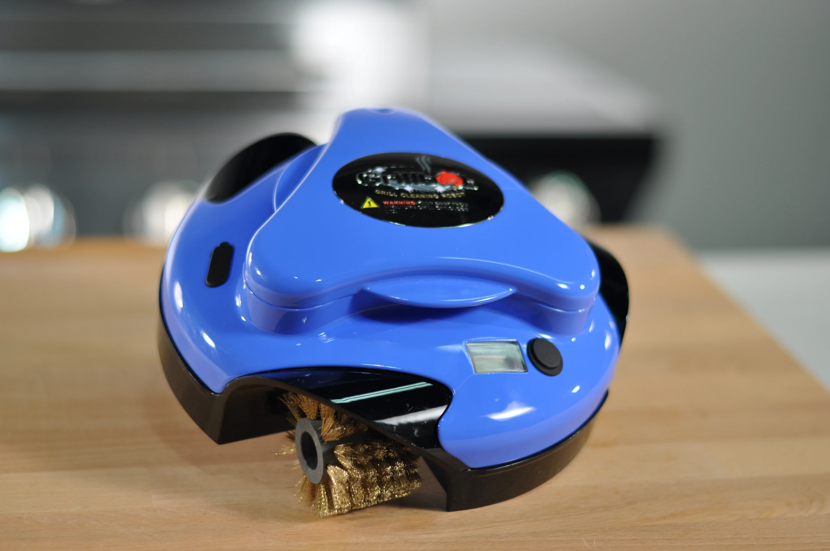 The Grillbot features push button operation