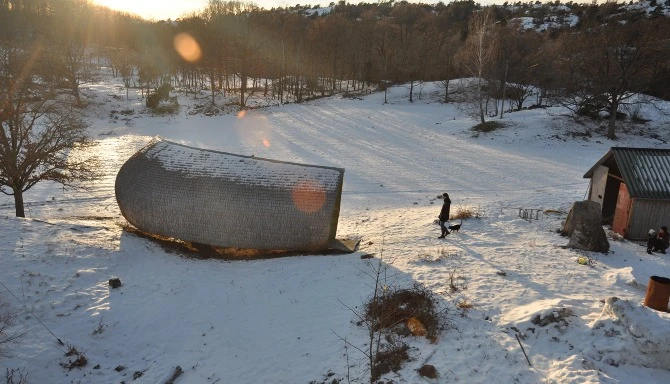 Tucked away in a valley on the west coast of Sweden, Hus-1 is a tiny home that resembles a giant log