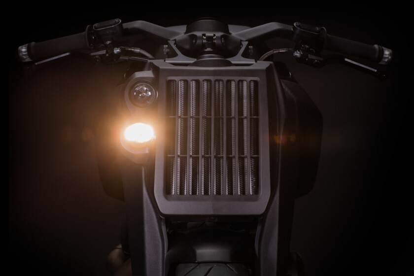 The Ronin's imposing radiator face, with projector beam headlights