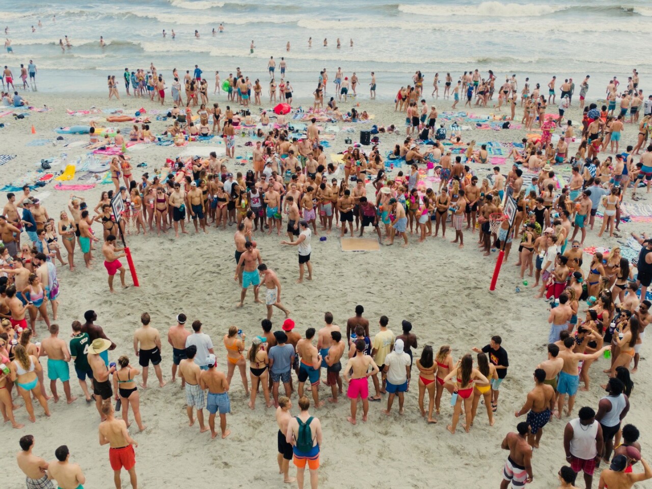 Drop a couple of Uball hoop sets in the sand, start a game, and watch the crowd gather