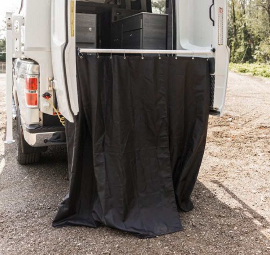 Grumpy Bear splits bathroom functions into an under-bench portable toilet and outdoor shower