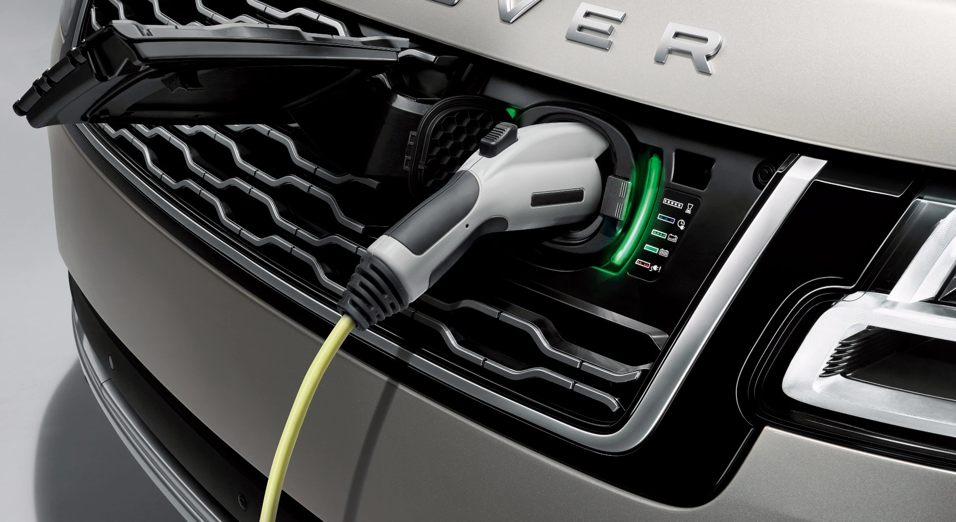The recharge socket on the Range Rover P400e is hidden behind a Land Rover badge on the front grille