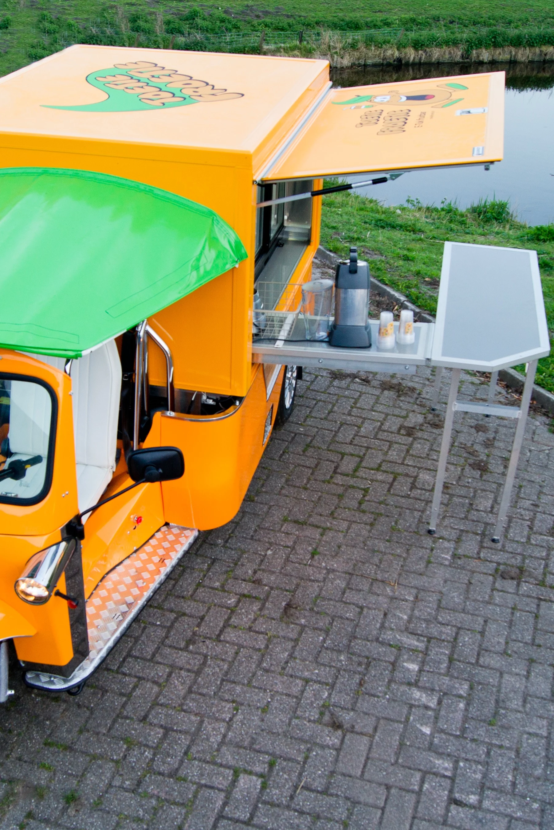 The Vendo incorporates a table that folds out from its side