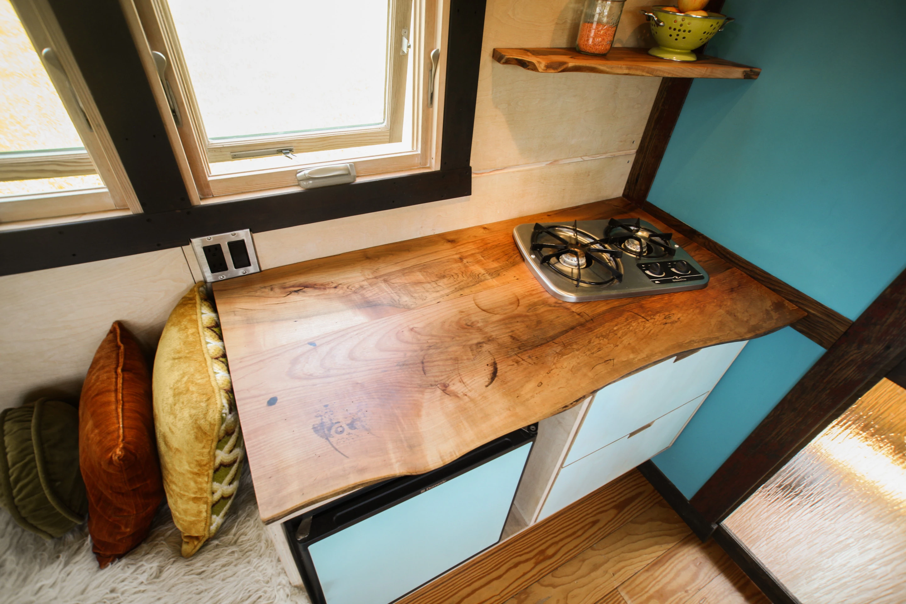 Pocket Shelter features a custom kitchenette with 2-burner gas cooktop