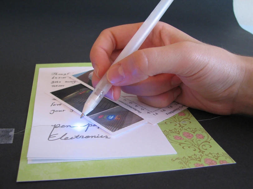 The silver pen can write electric circuits and interconnects directly on paper and other surfaces (Image: Bok Yeop Ahn)