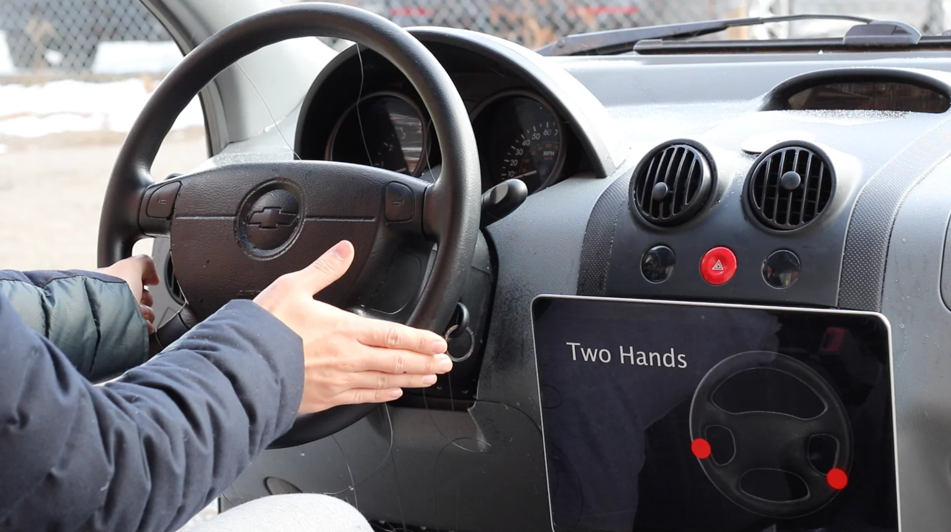 A touch control surface steering wheel identifying a two-handed touch